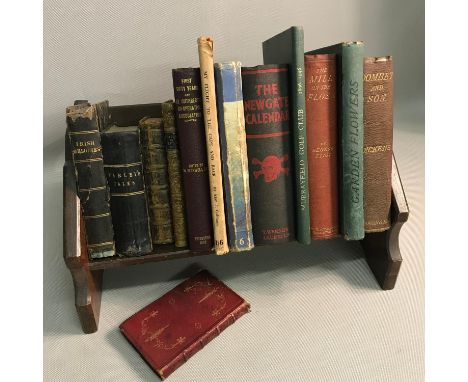 A Church style small bookcase together with various old books which includes The new gate calendar, Murrayfield golf club, Ir