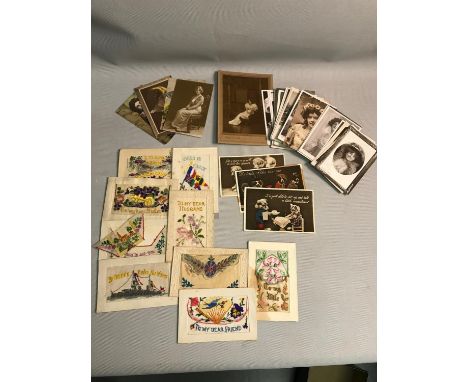 A collection of vintage postcards to include designs/themes such as tapestry, portrait and comedy 