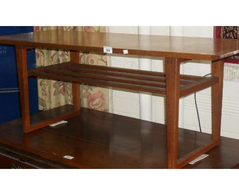 A c.1970's teak coffee table, with undertier slatted magazine shelf.