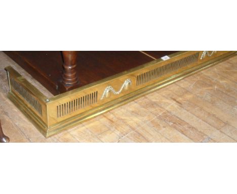 A good quality 19th Century Regency style pierced brass fender.