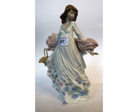 A Lladro model of a girl with floral dress holding a basket of flowers. CONDITION REPORT: Lot 557: Good condition