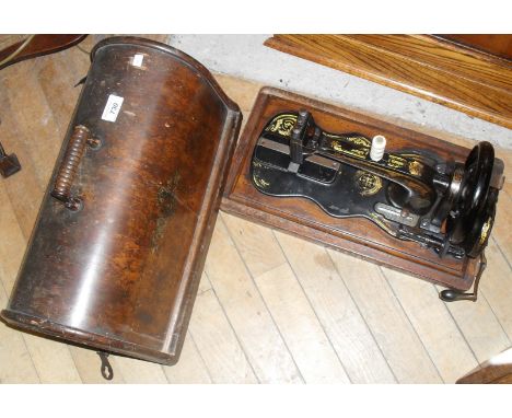 An unusual shaped Singer manual sewing machine.