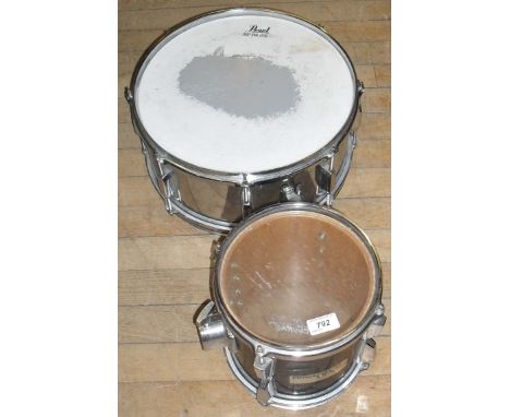 A modern pearl snare drum, together with a further drum.