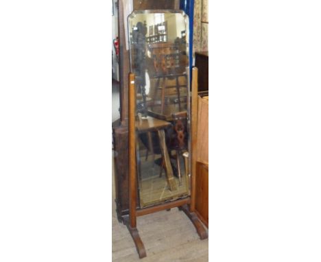 An early 20th Century oak framed bevelled edged cheval mirror.