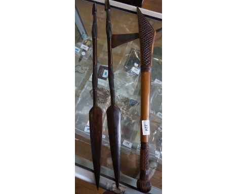 Two 20th Century African carved hardwood spears together with a light wood axe.