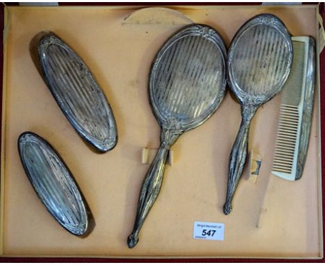 A cased hallmarked silver dressing table set comprising two clothes brushes, hair brush, hand mirror and hair comb (5).