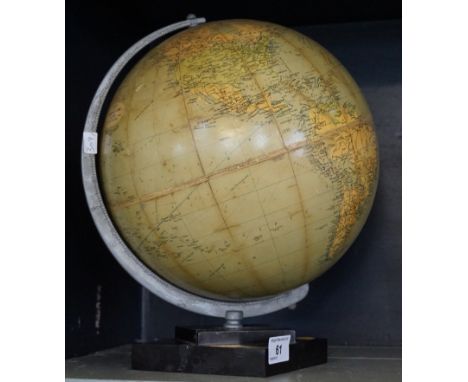 An Art Deco Phillips 10 inch challenge globe, raised on Bakelite plinth base.