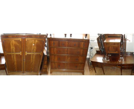 A mid 20th Century mahogany four piece bedroom suite, comprising twin door wardrobe, chest of five drawers, tryptic mirror ba