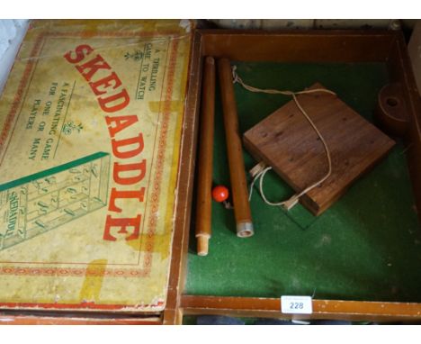 A vintage skittle table games together with a Skedaddle table game.