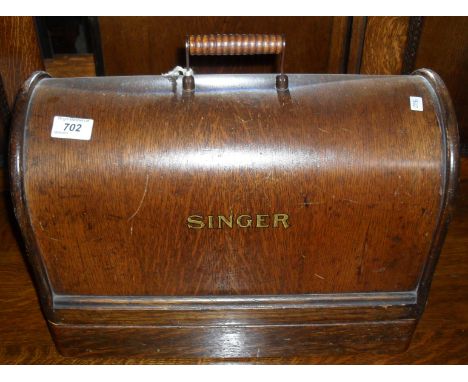 A vintage Singer manual sewing machine.