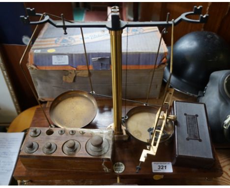A mid 20th Century McQuilkin of Glasgow balance scales, together with a cased pathescope.