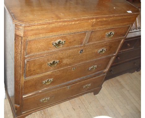 A Georgian crossbanded mahogany chest of two short over three long drawers, raised on bracket supports.