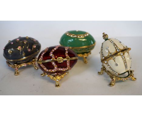 A collection of modern atlas edition Faberge eggs, approximately seven boxed and six unboxed, together with a further set of 