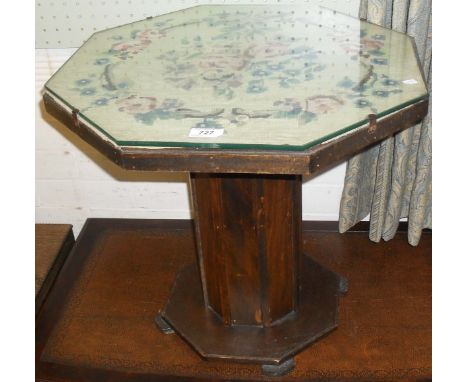 A 1920s/30s oak octagonal topped occasional coffee table, having tapestry inset panel.