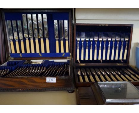 A 1920/30's oak cased silver-plated canteen of cutlery , together with a further mahogany cased example and a oak thermometer