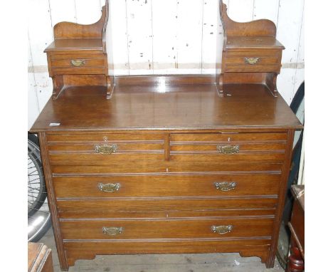 An oak dressing table, having two short over two longer drawers (lacking mirror).