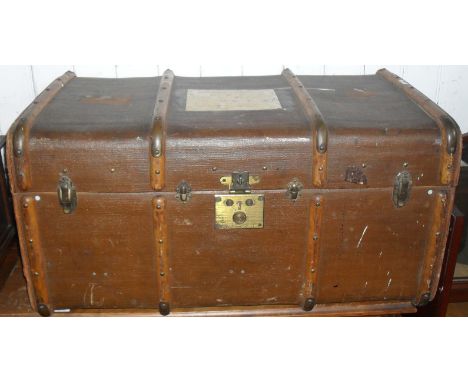 A hardwood bound canvas trunk.