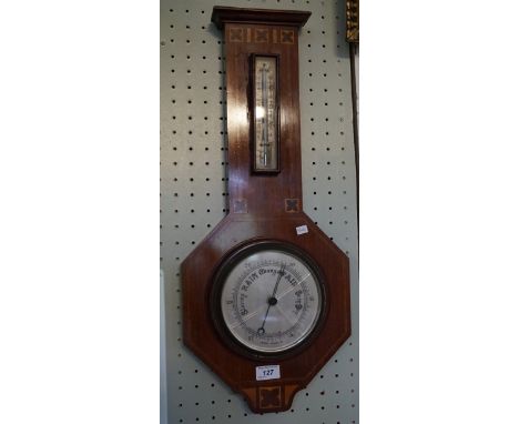 An Arts & Crafts inlaid mahogany banjo aneroid barometer.