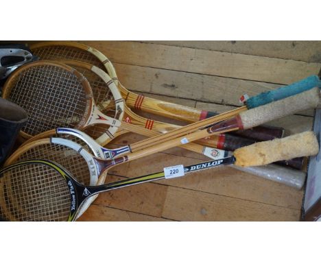 A large quantity of vintage ice skating boots and assorted vintage tennis rackets to include Dunlop and Kim examples.