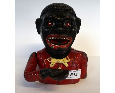 A novelty Jolly gentlemen money box, styled with red jacket and yellow bow tie. 