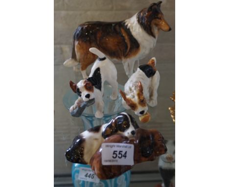 A mixed collection of Royal Doulton dog figures top include a model a Lassie dog, two Royal Doulton figures of dogs playing w