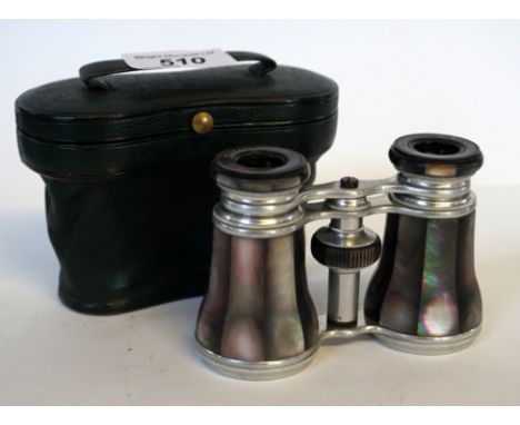A pair of French Negretti & Zambra mother of pearl inlaid and white metal opera glasses, fitted in original green leather cas