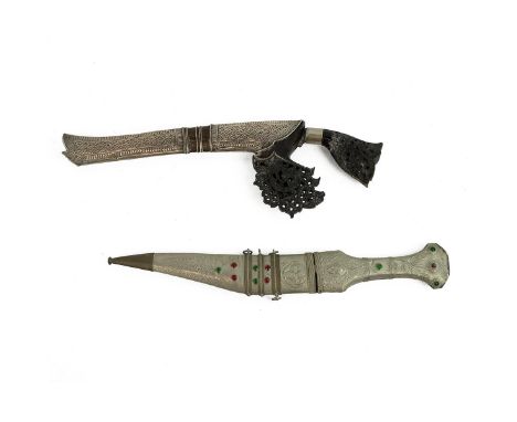 Two middle Eastern daggers, to include a Sumatra dagger with carved and pierced decorated horn handle, with a silver plated s