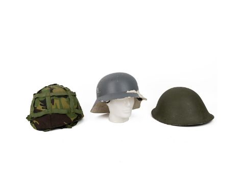 British Army MkV tin helmet, dated 1985; British army combat helmet Mk6, dated 1986 with camo cover; West German Civil Defenc