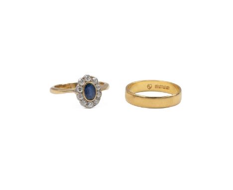 A yellow metal and diamond sapphire ring, finger size J, stamped 18ct, 2.7 grams, along with a 22ct gold wedding band, 2.73 g