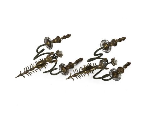 A pair of antique style brass two branch wall lamp sconces with pull chains and pierced drip pans, decorated with a central C