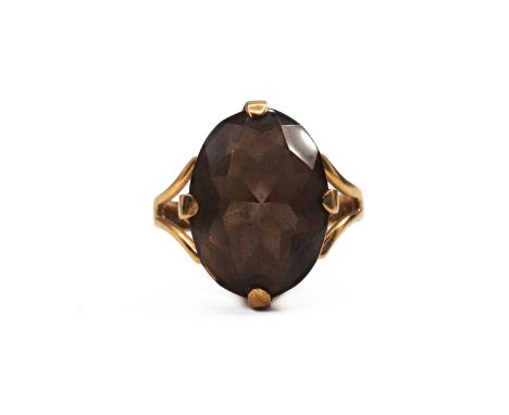 9ct ring, set with a smokey quartz stone, in a four-claw setting, finger M, 3.51grams gross.
