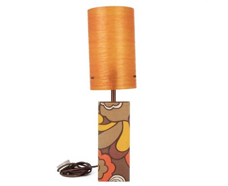 Mid-century/vintage lamp, with an orange fibre glass shade, standing on a fabric-covered base, 58cm high.