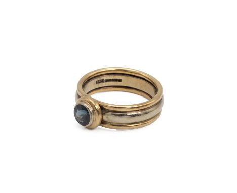 9ct gold ring, set with a red mixed cut stone, finger size N and 1/2, 7.7 grams.