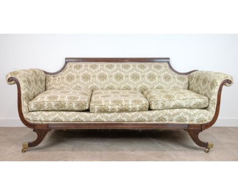 19th-century mahogany framed sofa, with scroll arms, a reeded and shaped back, 86cm high, 206cm long, 77cm deep.