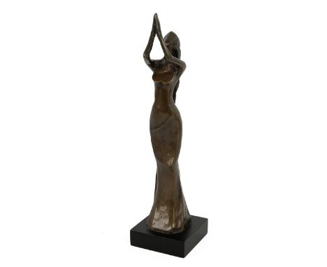 Bernard Kim (b 1942, Korean), after, patinated bronze figurine of a woman praying. Impressed marks '300/1989' and 'Kim B.' on