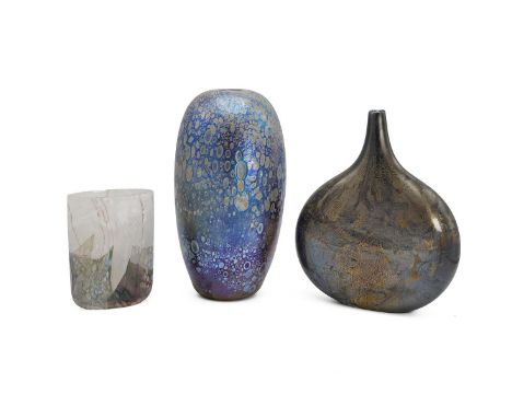 Three iridescent glass vases, one with paper label for Isle of Wight and the other two unsigned. Tallest 23cm. Width of the m
