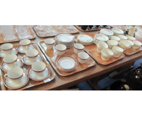 Two trays of Staffordshire gilt, foliate and burgundy teaware, together with two trays of Royal Worcester fine bone china 'Re