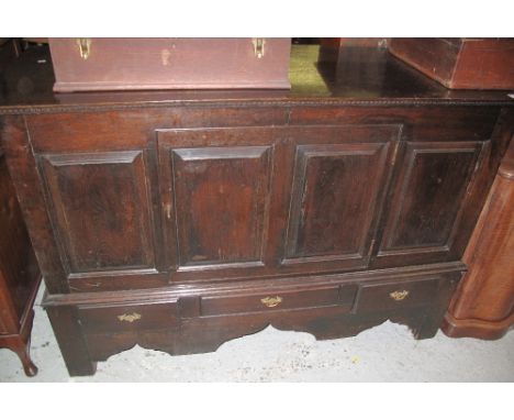18th Century oak mule chest, having four fielded and moulded panels, three drawers on bracket feet.(B.P. 24% incl. VAT)
