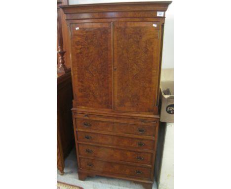 Reproduction walnut blind panelled cupboard or drinks cabinet, having brush slide and fitted drawers on bracket feet.(B.P. 24