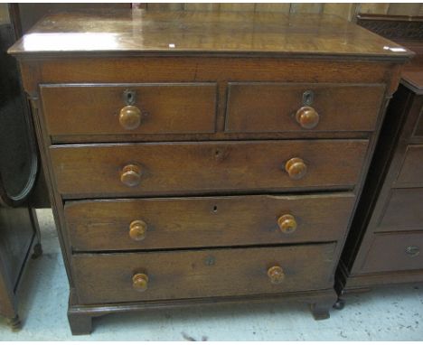 19th Century oak straight front chest of two short and three long drawers, with turned knobs, on bracket feet.(B.P. 24% incl.