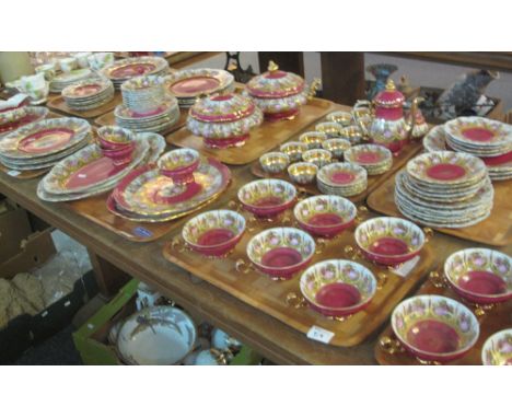 Nine trays of 'Bavaria' tea and dinnerware items on a gilt and burgundy ground with figures, comprising: cups and saucers; tw