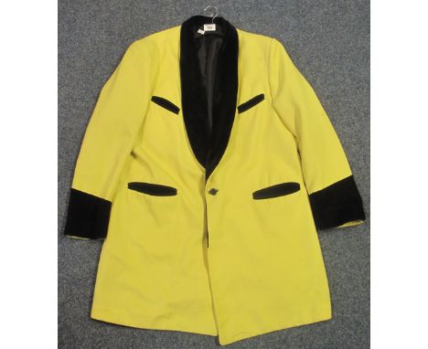 Yellow Teddy Boy style suit jacket with black velvet collars and cuffs.    CONDITION REPORT:  No label, probably a theatre co
