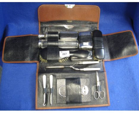 Leather gentleman's travelling vanity case with impressed Belgian address to interior, containing various dressing table jars