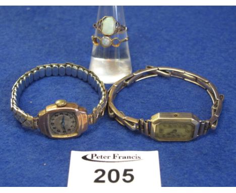 9ct gold lady's wristwatch and another yellow metal lady's wristwatch together with two 9ct gold, opal dress rings. (4)(B.P. 