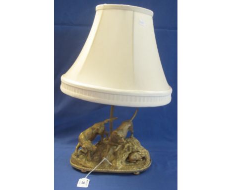 20th Century French gilt metal sculptural table lamp base, featuring two hounds and a rabbit, and having fabric shade.  Unsig