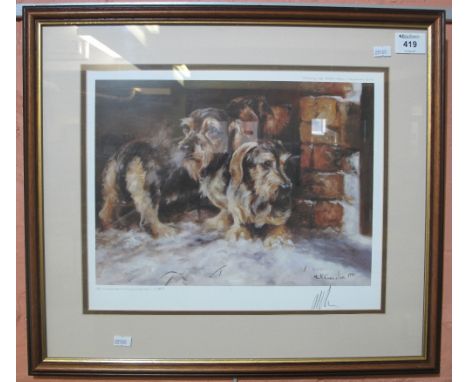 After Mick Cawston, a framed limited edition print depicting dogs in the snow, signed in pencil. (B.P. 24% incl. VAT)