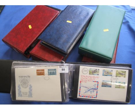 Channel islands and Isle of Man range of first day covers in four stamp albums together with three empty albums.