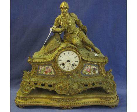 19th Century French Ormolu figural mantel clock, the case surmounted by a reclining knight in armour, having white enamel fac