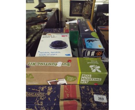 A Box Containing Children's Toys to Include Microscope, Bug Hunting Kit, Temperature Station, Night Sky Projection Kit Etc.