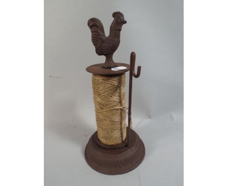 A String Dispenser with Cockerel Finial.